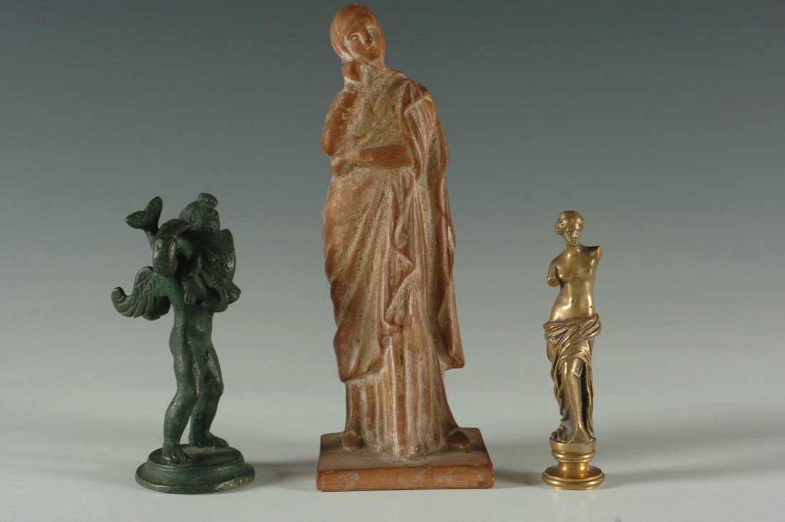 THREE SMALL GRAND TOUR FIGURES: Includes a tall terra cotta figure, 7.5 inches, 'Radisi' marked bottom. A green finished bronze figure, 4.5 inches, and a 4.25 inch Venus figure stamp with monogram.