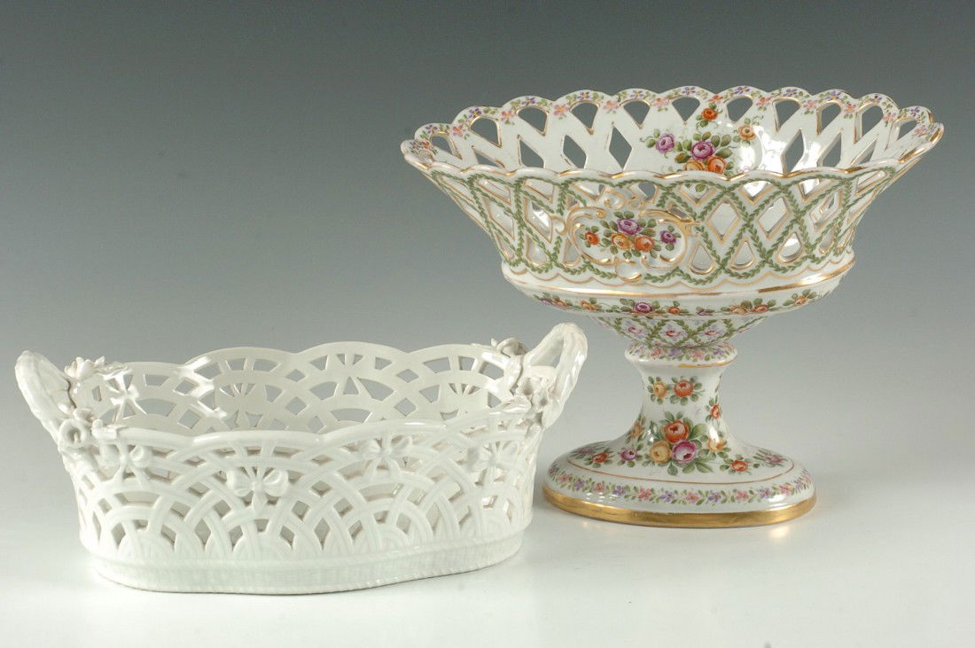 TWO PIECES OF CONTINENTAL PORCELAIN INCL KPM: A KPM basket with applied flowers at the handles and blue scepter mark under glaze measures 4 x 10 x 6 inches, plus an 8 x 9 x 6 inch basket on pedestal with blue mark over glaze.