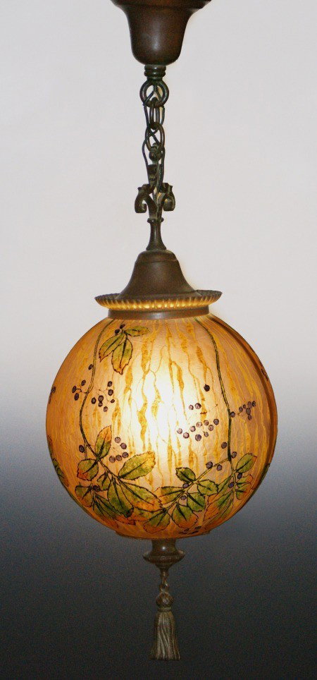 HANDEL OBVERSE PAINTED TEROMA GLASS CHANDELIER BRONZE: A rare hanging light fixture with textured and 'chipped ice' effect reverse painted glass shade decorated with hanging berries among vines and foliage, all of the original bronze mounts. Measures 10 i