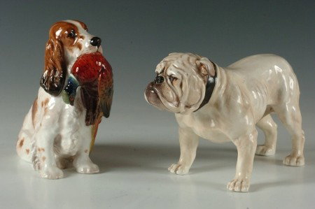 TWO ROYAL DOULTON PORCELAIN DOG FIGURES: A Bulldog numbered 1072, 6 x 9 inches and a Cocker Spaniel with Pheasant numbered 1001 measures 6 x 7 inches