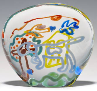 A RICHARD JOLLEY 'PRIMARY COLOR' MODERNIST PAPERWEIGHT: Richard Joley Circa 2000. Paperweight by Knoxville Tennessee glass sculptor Richard Joley features internal whimsically executed decoration of bird, heart, tree, dog, house, tree - all encased in clea