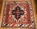 18: A 43 X 47 INCH EAGLE KAZAK PATTERN RUG