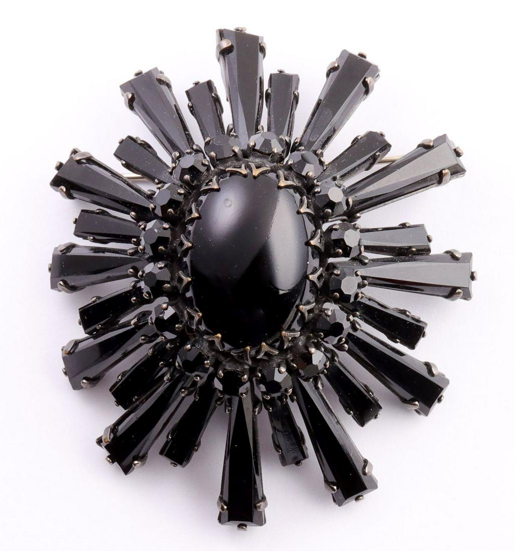 A BLACK-ON-BLACK RUFFLE BROOCH SIGNED SCHREINER: Please note that after the auction we will complete invoicing and then immediately close our offices for the remainder of the holiday season. There will be no options for making payment, arranging shi
