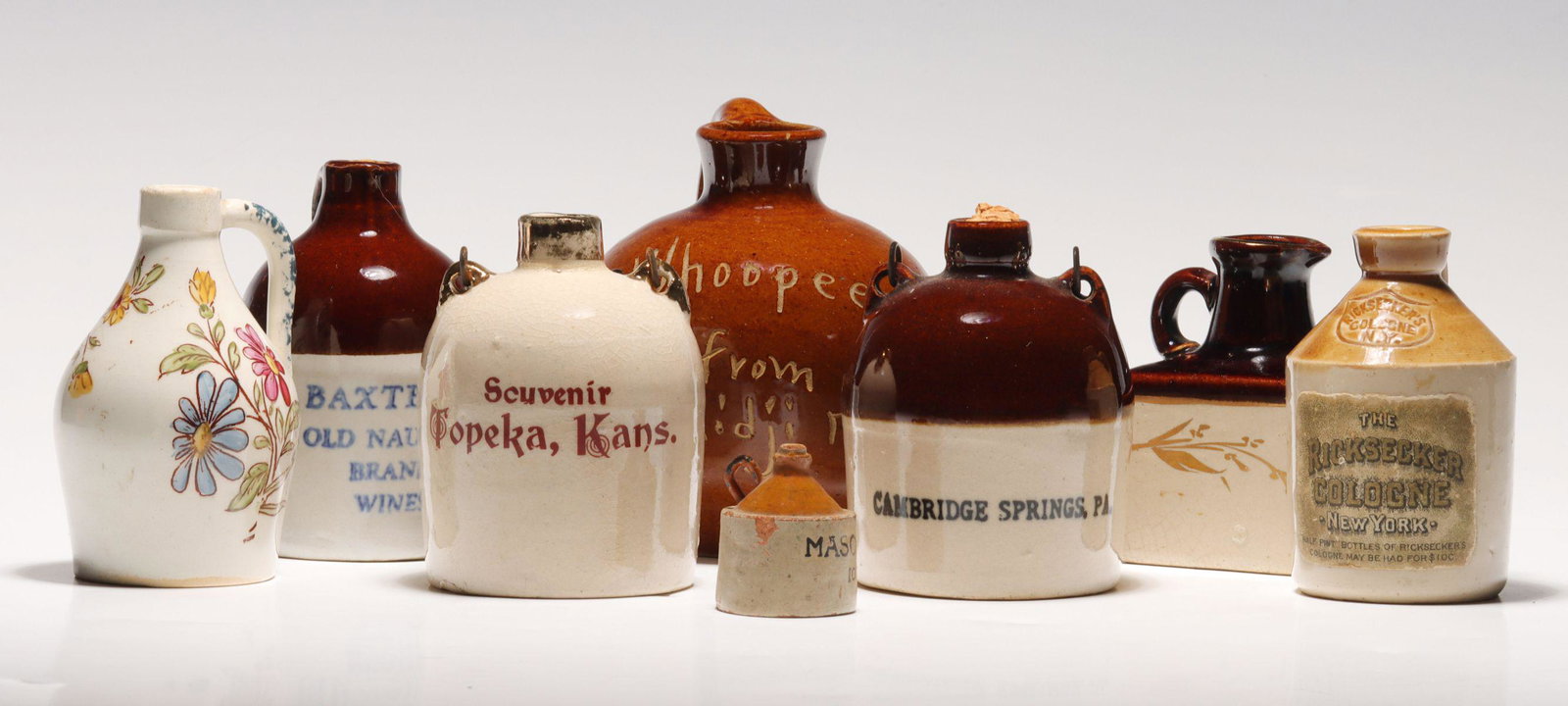 A COLLECTION OF SOUVENIR STONEWARE MINI JUGS (1 of 19)