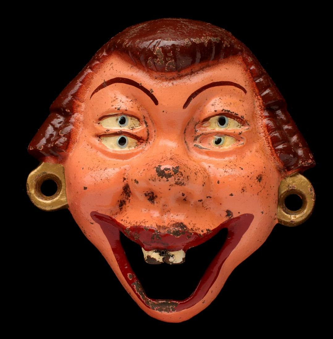 A VINTAGE FIGURAL IRON WALL MOUNT BOTTLE OPENER (1 of 10)