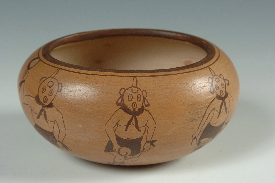 HOPI POTTERY BOWL WITH DANCERS, SHIRLEY BENN NAMPEYO: Slip painted with tan background and eight animated mud head dancers in line drawings, measures 2.5 x 3.75 x 4.75 inches.