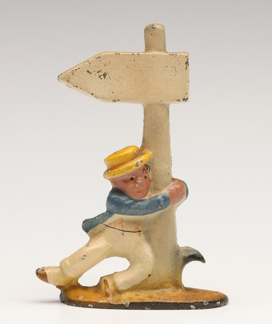 A VINTAGE FIGURAL IRON BOTTLE OPENER (1 of 9)
