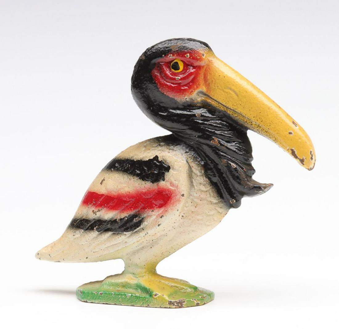 A VINTAGE FIGURAL PELICAN IRON BOTTLE OPENER: An original period example from the second quarter of the 20th century. We happily provide seamless in-house packing and shipping services on nearly everything we sell. Until further notice, we cannot