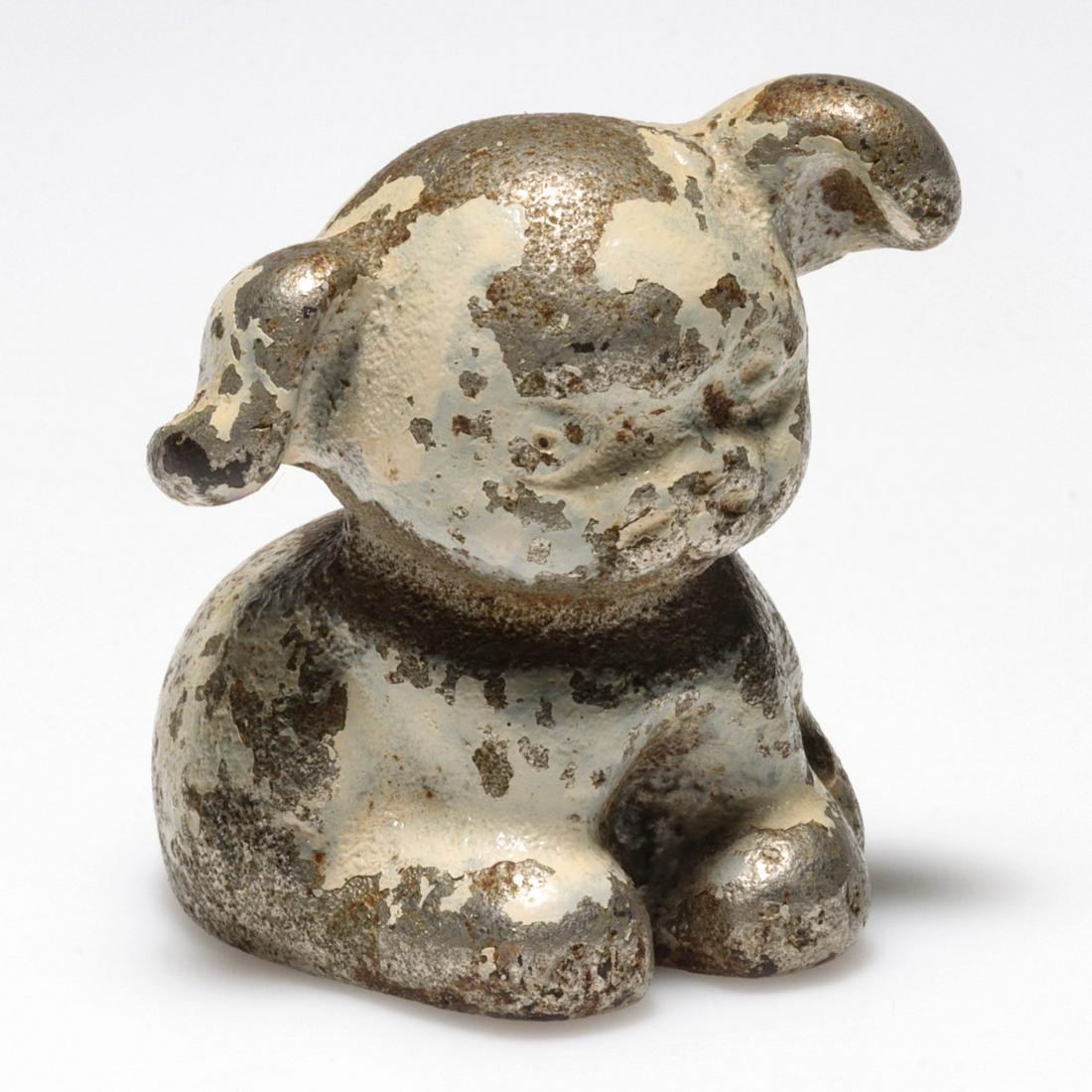 A FIGURAL PUP CAST IRON ADVERTISING PAPERWEIGHT (1 of 5)