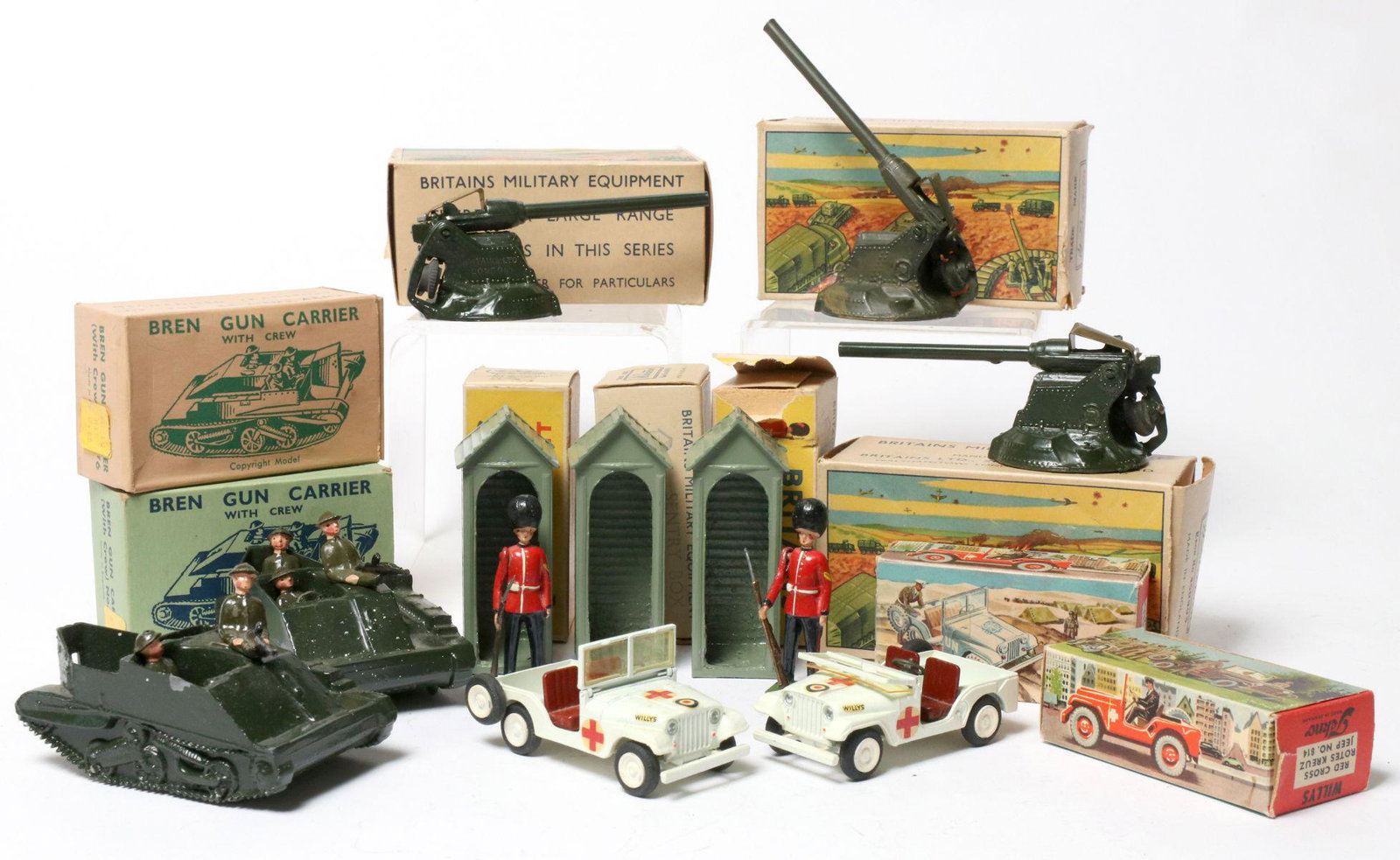 BRITAINS AND OTHER MILITARY VEHICLES IN ORIG BOX: 1. Two Sentry's with three Sentry Box Shelters No. 329. 2. Two Tekno Red Cross Willys. 3. Two Bren Gun Carrier with two and three man Crews. 4. Anti-Aircraft guns with repaint. Without proof of exempt