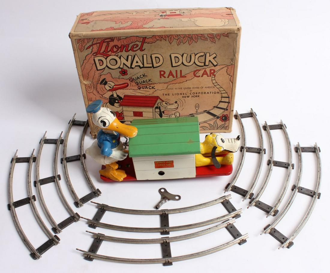 LIONEL DONALD DUCK RAILCAR W/TRACK IN ORIGINAL BOX: The 1930s wind-up toy rail car with long-billed Donald and Pluto is found in its original 1930s box. Without proof of exemption,, be aware that internet sales tax applies to all Internet transactions 