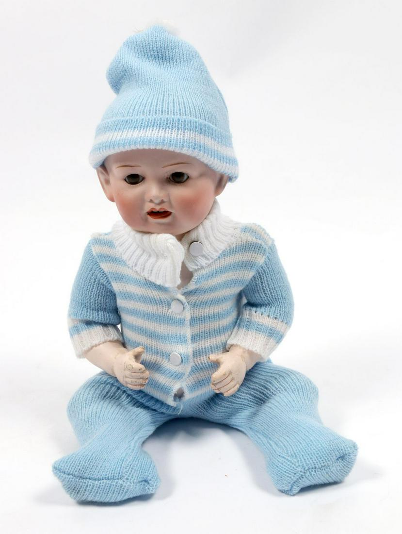AN ANTIQUE BISQUE DOME HEAD BENT LIMB TODDLER DOLL (1 of 5)