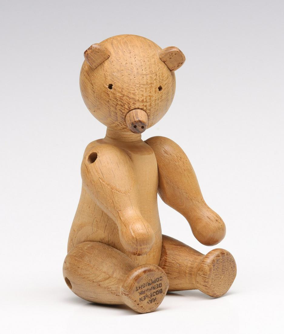 KAY BOJESEN (1886-1958) ARTICULATED TEAK BEAR: The mid 20th century sitting bear cub figure is signed with branded copyright mark as shown. Without proof of exemption,, be aware that internet sales tax applies to all Internet transactions and loca