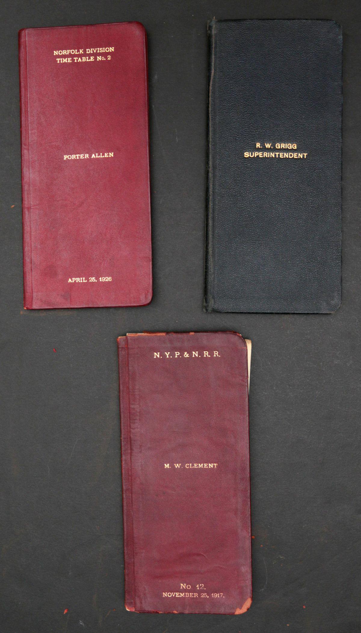 NYP&N RAILROAD SUPERINTENDENT LEATHER TIMETABLES: Three New York, Philadelphia and Norfolk Railroad employee (Government of Employees) timetables are bound in gold embossed black leather. Most single lots can ship via USPS priority mail for $23.00 pl