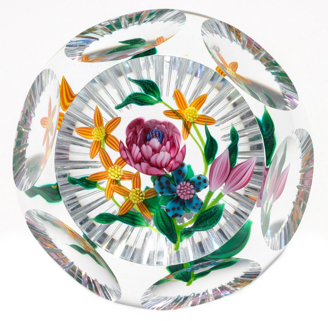 KEN ROSENFELD MULTI-FACETED LAMPWORKED BOUQUET IN CLEAR: Ken Rosenfeld's exquisitely lampworked flower bouquet with pink peony and five other flowers all with complex millefiori cane centers, emerging buds, stems and leaves. Top facet, 6 side facets and sle