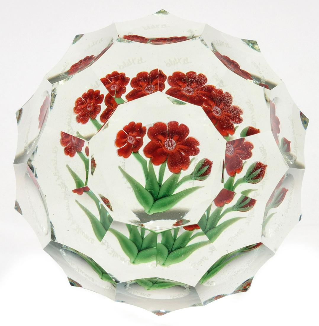 GREG HELD, ORIENT & FLUME, MULTI-FACETED FLORAL: Greg Held was senior designer at Orient & Flume and passed away in 1999. His lampworked reddish-orange flower design comes to life with the artistically cut multi-faceting on the weight. Underneath th