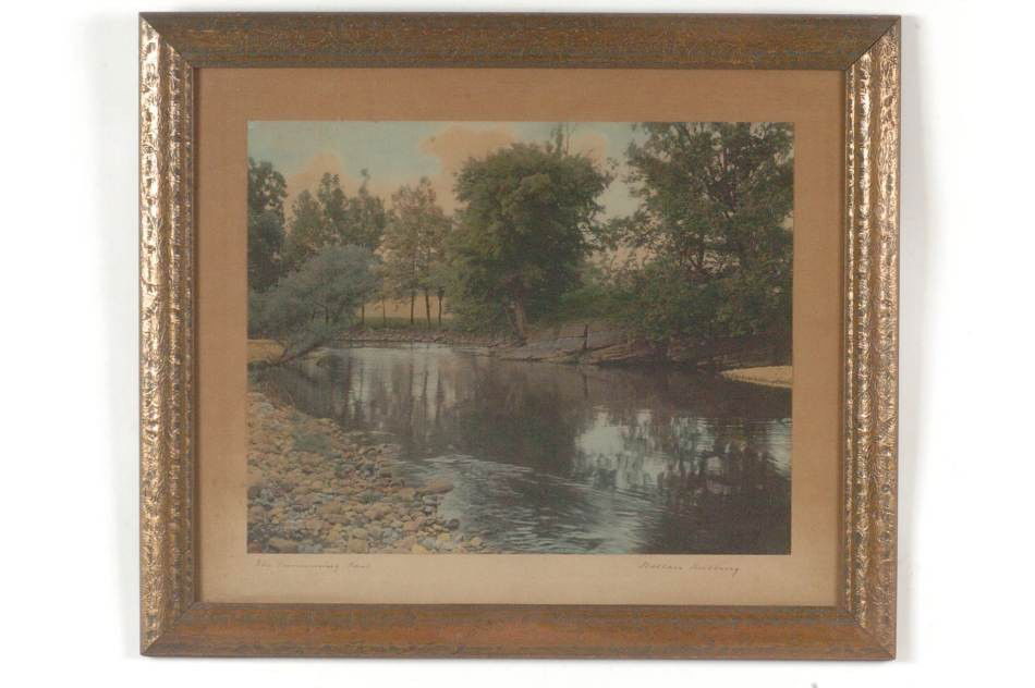 WALLACE NUTTING (1861-1941) SIGNED TINTED PHOTOGRAPH 'T: Hand tinted photo by Nutting, titled 'The Swimming Pool' in lower left margin, signed lower right. Matted and framed in old materials. Photo measures 15.5 x 19.5 inches. Frame larger.