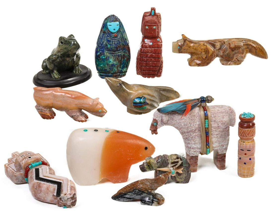 ZUNI CARVED SEMI-PRECIOUS STONE FETISHES: The collection of carved and inlaid figures are offered as shown here with embellishments of feathers and glass beads - along with inlays of turquoise and onyx. Measures 1 to 3.5 inches tall. Provenan