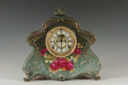 ANSONIA ROYAL BONN CHINA CASE CLOCK: With double sunk dial and exposed escapement, measures 13 x 14 x 5 inches.
