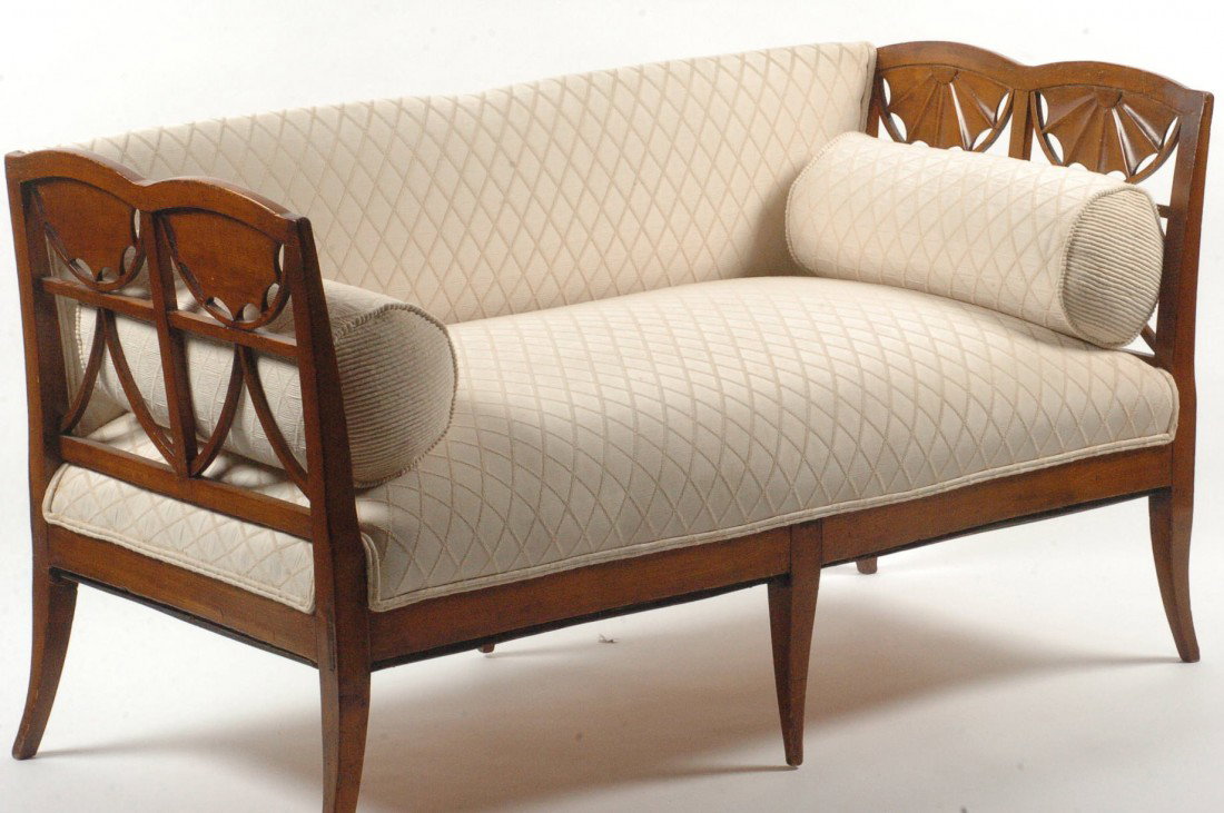 19TH CENTURY FRENCH FRUITWOOD DAYBED: A fine piece of furniture with mortised construction, nice lines, good patina color, sabre legs and carved half-sunflowers above lattice ends, measures 31 x 27 x 55 inches