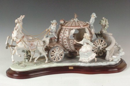 LARGE LLADRO GROUPING CINDERELLA 'AT STROKE TWELVE: Lladro sculpture of Cinderella's carriage 'At Stroke Twelve' 1493 by sculptor Jose Roig. Retired in 1992. With its wooden base. 11 x 26 inches. The original box is included.