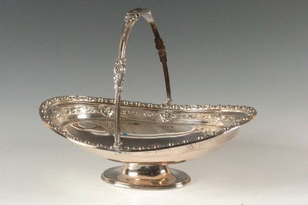 VICTORIAN QUADRUPLE PLATE CAKE BASKET: Marked 'Mappin & Webb, London, Sheffield W1826,' 9.5 x 12 x 8.75 inches.