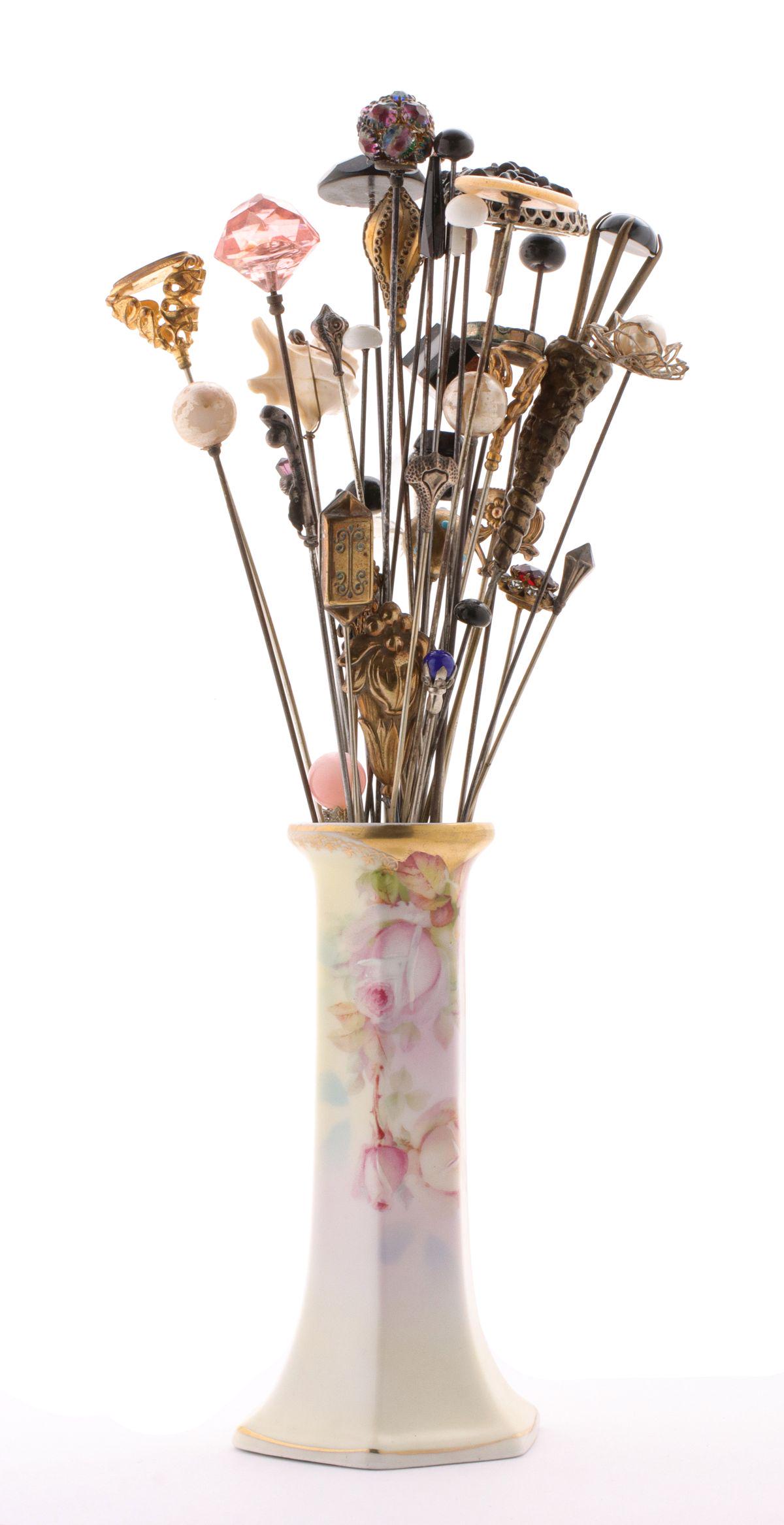 A COLLECTION OF FORTY-ONE ANTIQUE HATPINS IN HOLDER (1 of 12)