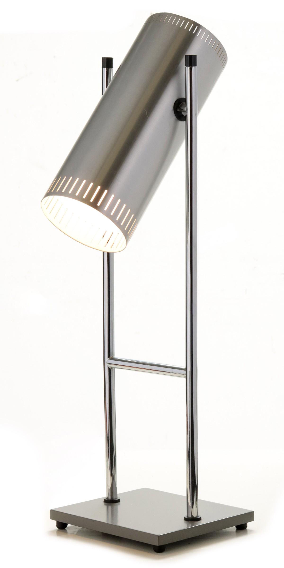 A JO HAMMERBORG TROMBONE TABLE LAMP FOR FOG & MORUP: The circa 1960s table lamp with cylindrical brushed aluminum shade supported by chrome uprights raised on a square enamel base is attributed to the Danish lighting firm of Fog & Morup, design by Jo Ha