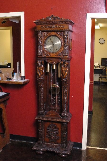 ELABORATE FRENCH TALL CLOCK MALE FIGURES ODOBEZ 20TH C: The movement stamped with the maker's mark for high quality French clock maker Odobez (stamped ODO Made in France), great case with carved standing male figures, time, strike and chime, measures 80 x