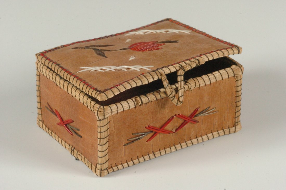 A CHIPPEWA BIRCH BARK BOW WITH QUILL EMBELLISHMENT: A small box with a cute latching mechanism. A note inside states that this piece was purchased from a Mr. Billy Burgess, president of the Haskell Indian Institute, Lawrence, Kansas. Measures 2 x 4 x 3