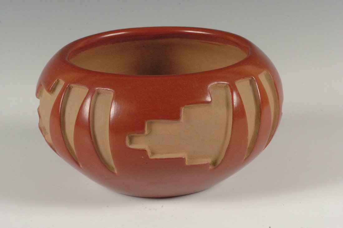 A SANTA CLARA POTTERY BOWL SIGNED BELEN TAPIA: Polished red with deep carved designs of steps and feathers, measures 4.5 x 7.5 inches
