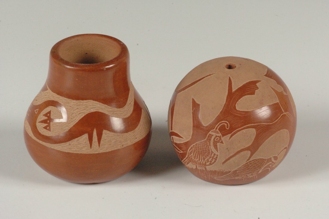 SANTA CLARA AND SAN ILDEFONSO POTTERY: Two pieces that include a 2.75 x 2.5 inch pot with carved water serpent and signed Adelphia (Martinez). Plus a 2.5 inch ball-shaped pot signed Camilo Tafoya with incised forest scene.