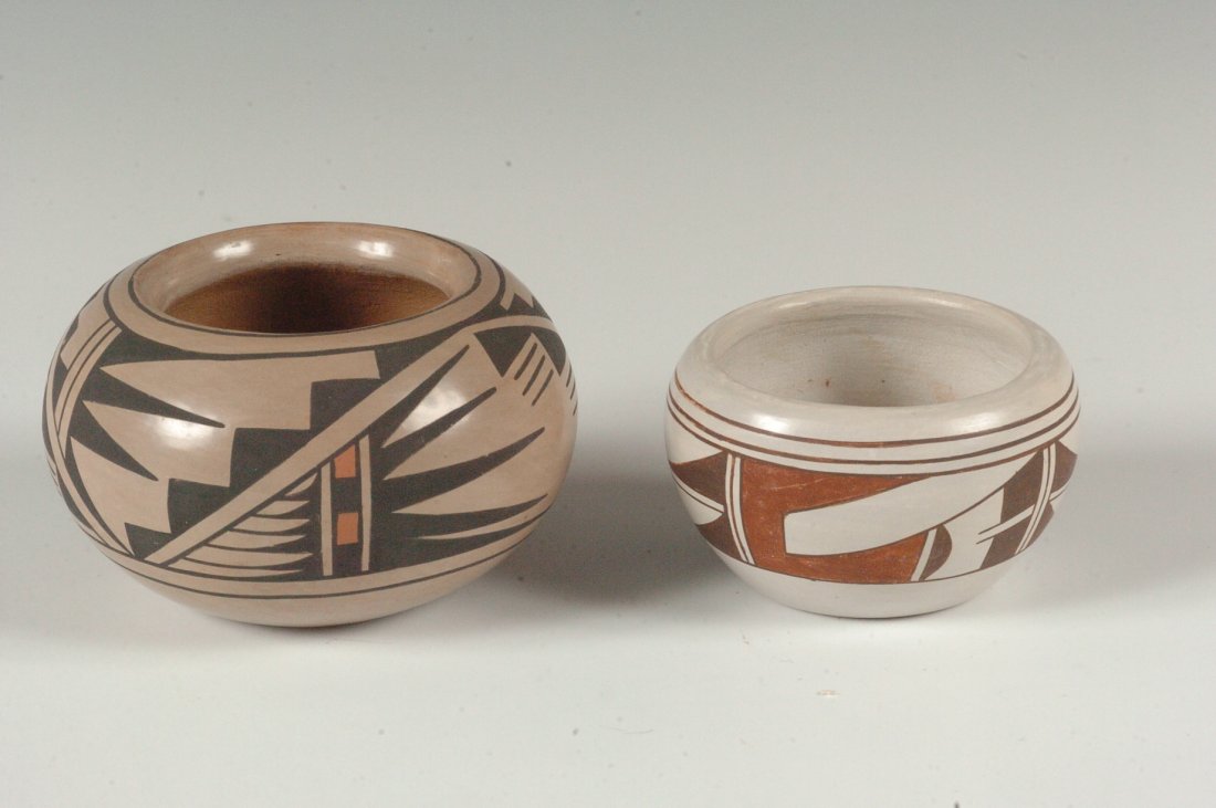 BLUE CORN AND FROG WOMAN: TWO POTTERY PIECES: A San Ildefonso pot 2.25 x 4 inches signed 'Blue Corn San Ildefonso', plus a second piece of Hopi pottery signed with the symbol for Frog Woman measures 2 x 3 inches