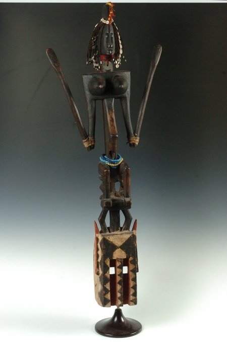 DOGON HEADDRESS, MALI: Top is a female figure on a two legged stool with cowry shells in her fiber hair, a 1919 British West Africa penny for a necklace, trade beads around the waist and many earrings, lip and nose rings. P