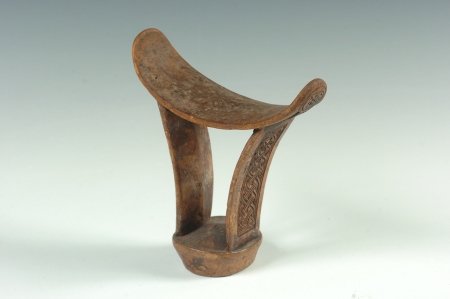 CARVED WOOD HEADREST, SOMALI: With intricate carved designs on the sides, 7 x 6 inches.