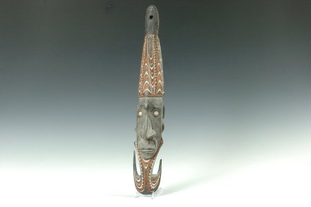 MT. HAGEN & CHAMBRI LAKES MASKS, NEW GUINEA: Trade masks of a elongated human faces with cowry shell eyes and incised decorations. 18 and 20 inches.