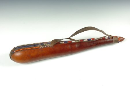 MAASAI MILK GOURD, KENYA: Leather strap with beadwork and a pearl button. 28 inches.