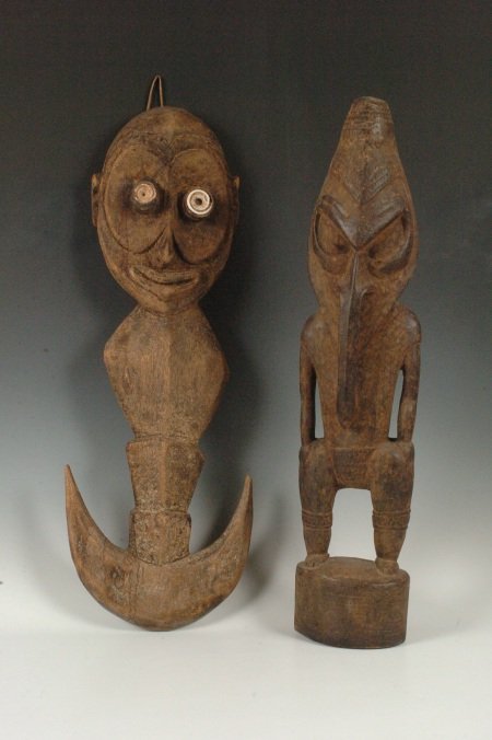 SEPIC RIVER HANGING HOOK PLUS CARVED FIGURE, NEW GUINEA: Old carved wood hanger in the form of a face with shell eyes and a stylized body. Used to suspended clothes and food baskets away from kids and dogs. 25 inches. Lower Sepki standing male figure carved