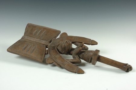 YORUBA SHANGO DANCE WAND, NIGERIA: Carved wood dance wand of a kneeling priestess. Used in festivals worshiping Yoruba, the thundergod. 21 x 8 inches.