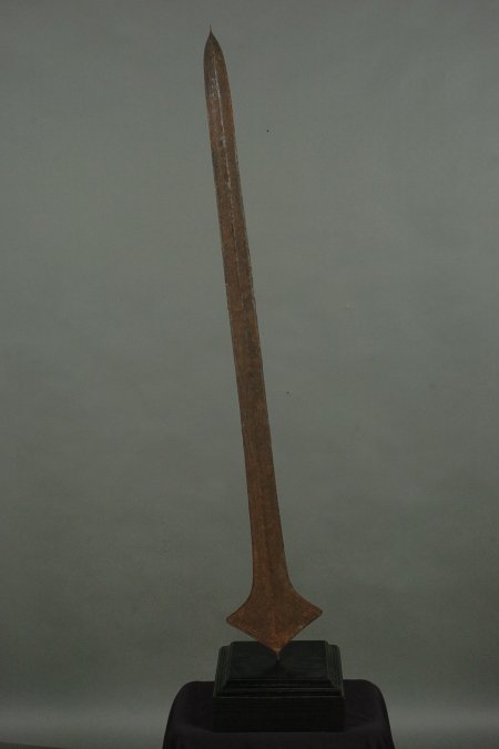 LUBA BANTU SPEAR BLADE, CONGO: Long spear blade used as currency. Mounted on an 11 inch wooden base. 54 inches.