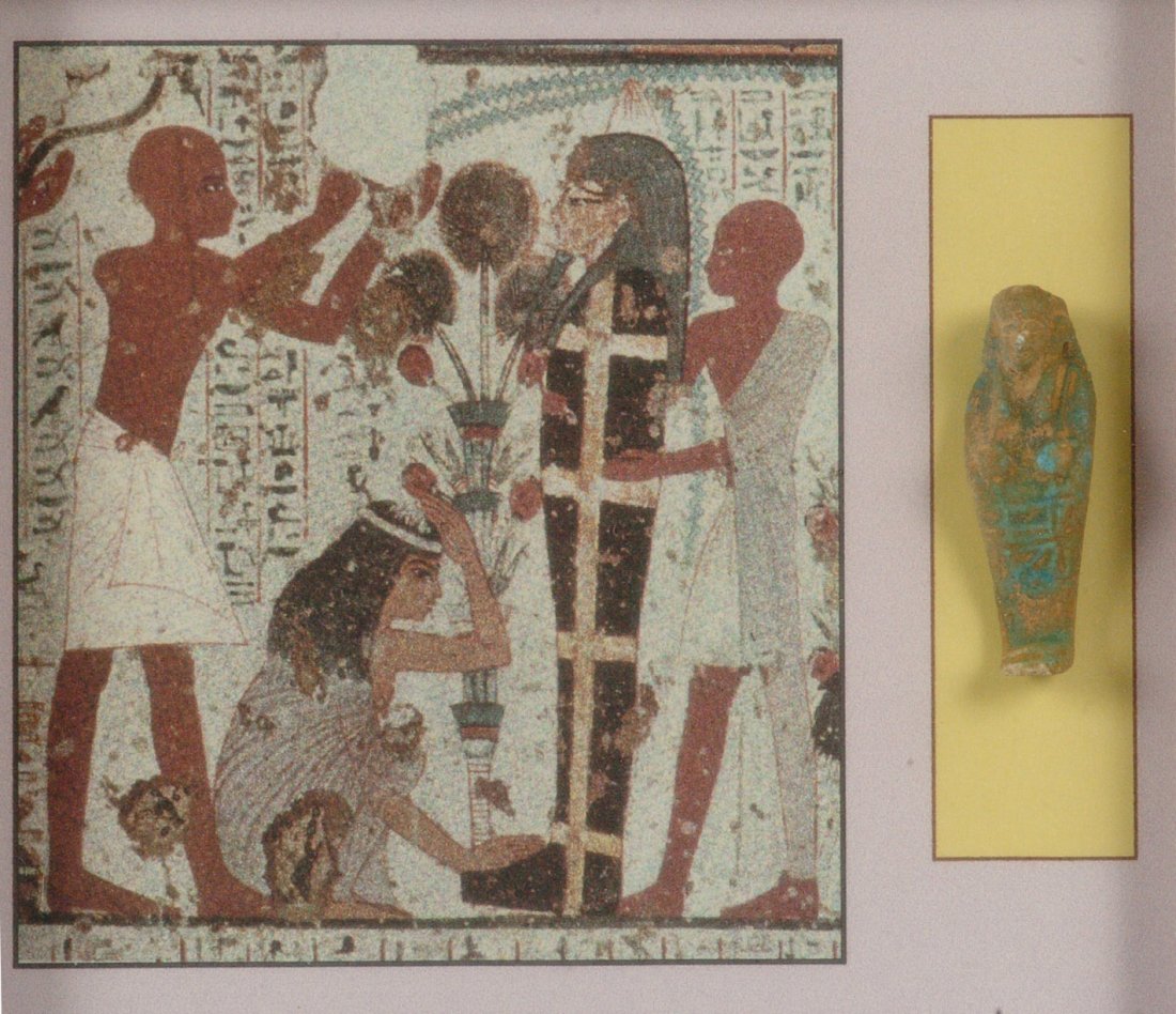 AN EGYPTIAN MUMMY BEAD NECKLACE & AN USHABTI: Faience bead necklace of pipe and disc beads in green, blue and earth tones, restrung, matted and framed, 24 inch necklace in a 14 x 11 inch frame; and an Egyptian Ushabti in terra cotta and turquoise