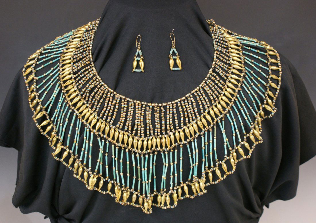 FOUR EGYPTIAN COLLAR NECKLACES W/ 3 SETS OF EARRINGS: With blue or green faience tubular beads and multi-colored disc beads with modern 22kt gold plate beads. 18 to 25 inches each. Not guaranteed to be ancient, but assumed to be reproductions.