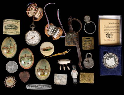 A COLLECTION OF 1904 ST. LOUIS WORLD'S FAIR SOUVENIRS: Includes: Three tin litho eggs; a St. Louis Exposition in a Nutshell miniature album; A World's Fair lapel watch; An advertising cigar cutter for Majestic Mfg. Co. in St. Louis; A 1904 Missouri mule t