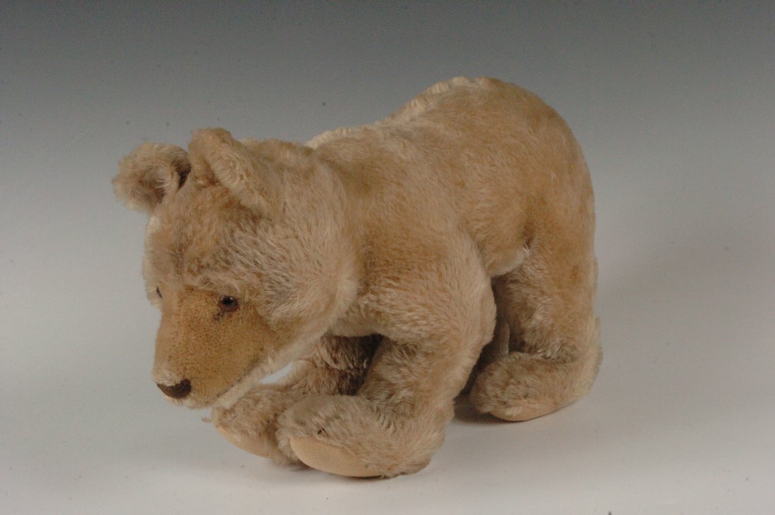 MOHAIR EXCELSIOR FILLED STEIFF BEAR ON ALL FOURS: Steiff Bear on all fours, tan mohair straw stuffed felt pads, button in ear. 8.25 x 13.5 inches.