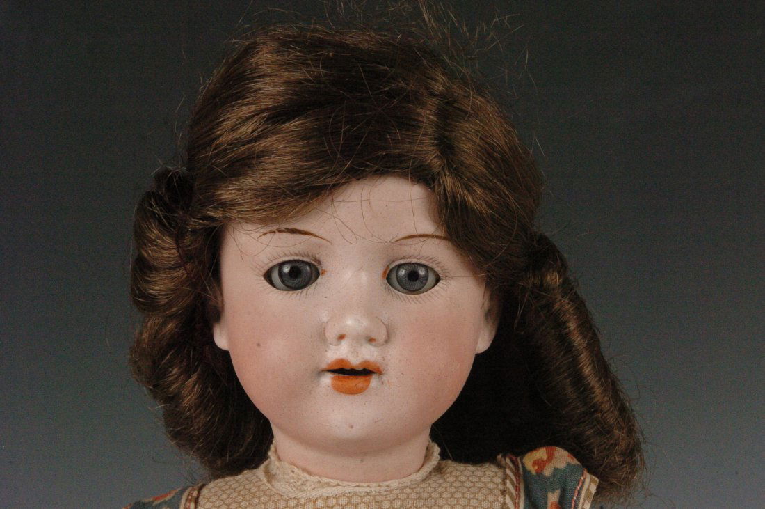 ARMAND MARSEILLES BISQUE HEAD DOLL: Bisque socket head with the impressed marks of Armand Marseille Germany 390 A2/OX M, fixed blue paper weight eyes, open mouth, cardboard pate, composition body, measures 15.5 x 5 inches