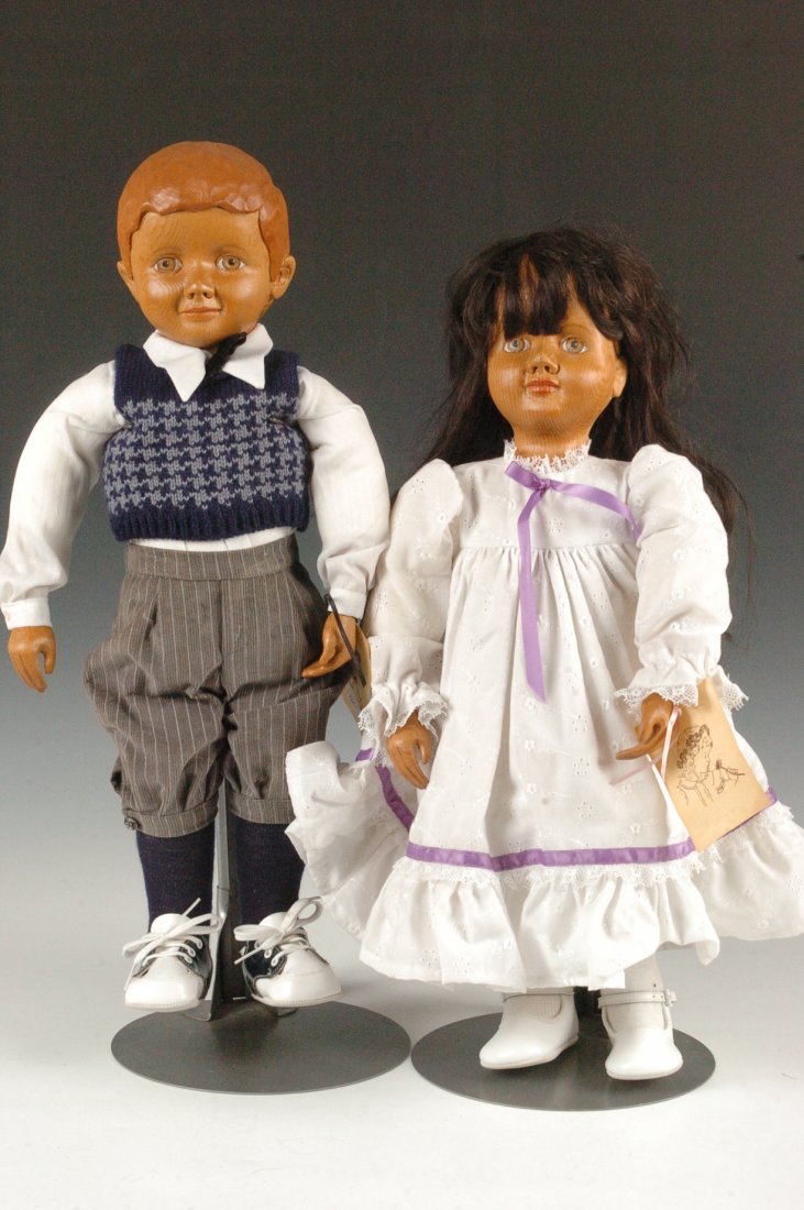 TWO DOLLS BY BOB AND CAROL RAIKES: Two hand carved wooden dolls by Bob and Carol Raikes, one tagged B104 Jonathan measures 22 x 9 inches, the second tagged G387 Rosetta measures 21.25 x 9 inches