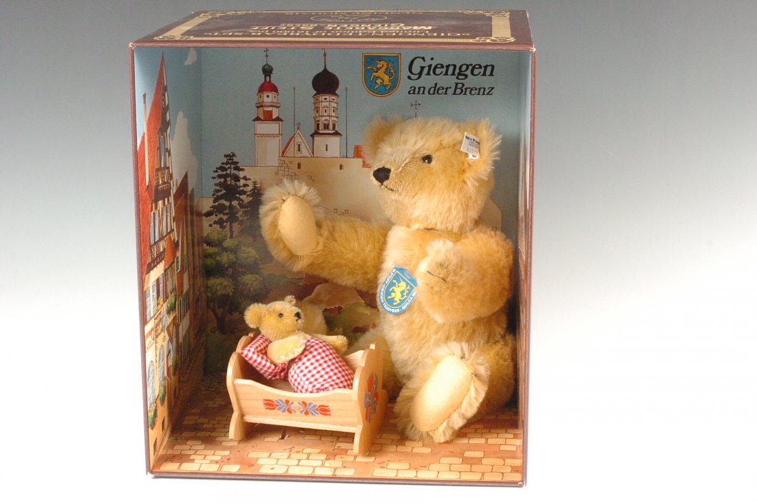 STEIFF GIENGEN TEDDY BEAR SET: Steiff Giengen Teddy Bear Set, Blond mohair, White tag 0162/00 02570, chest tag, mother and baby bear, still fastened in the original illustrated presentation box, Box numbered 002570. Mother bear mea