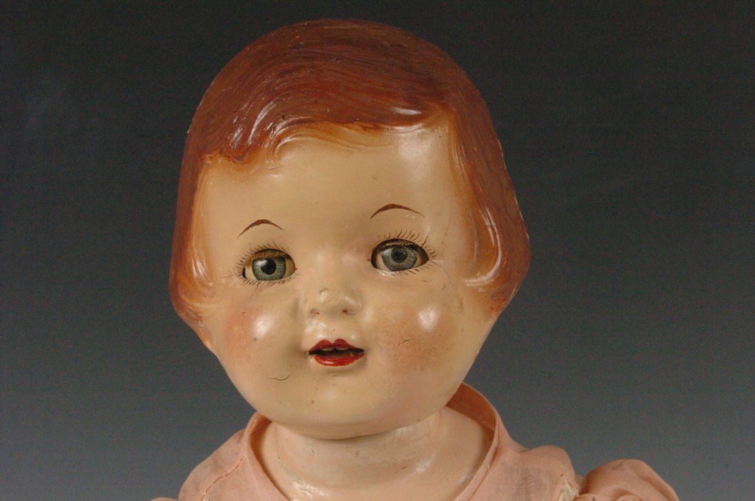 EFFANBEE COMPOSITION DOLL: Small cracks around eyes, cracks on sides of head, Composition limbs, Cloth body, Measures 19.25 x 8.5 inches.