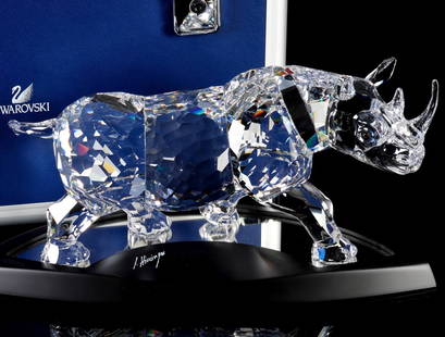 SWAROVSKI LIMITED EDITION RHINOCEROS WITH BOXES: The 2008 rhinoceros is 05765/10000 numbered limited edition. Comes mirrored platform, hard locking case, and a certificate of authenticity as pictured. Rhinoceros measures 5.75 x 12.75 x 4.5 and the c