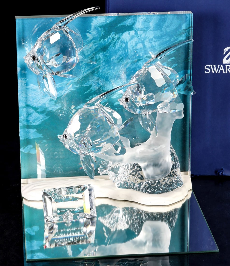SWAROVSKI 2007 WONDERS OF THE SEA COMMUNITY: Wonders of the Sea Community, A 9100 NR 000 044/854651, with plaque, stand, background, brochure, and boxes as pictured. Measures 7.5 x 7.5 x 3.75 inches. Without proof of exemption, be aware that int